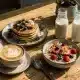 Table de brunch avec différents type de laits végétaux ainsi qu'un café et des pancakes